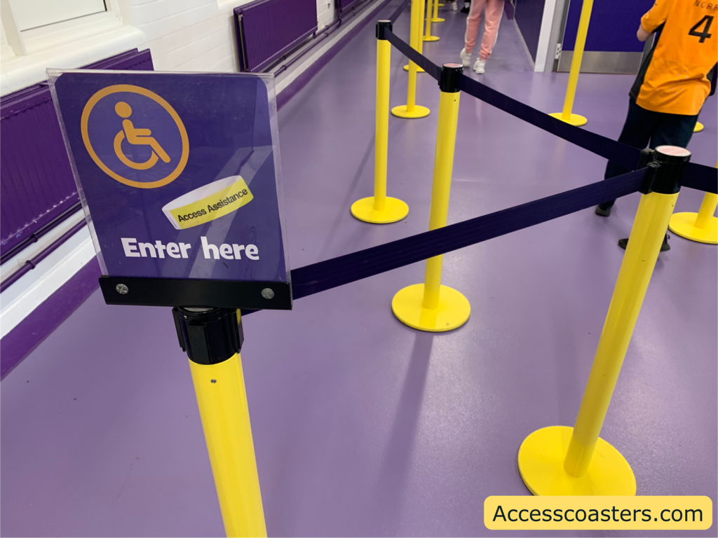 Image of access wristband entrance for Cadbury Chocolate Quest. you can see a sign with a wristband and wheelchair symbol on