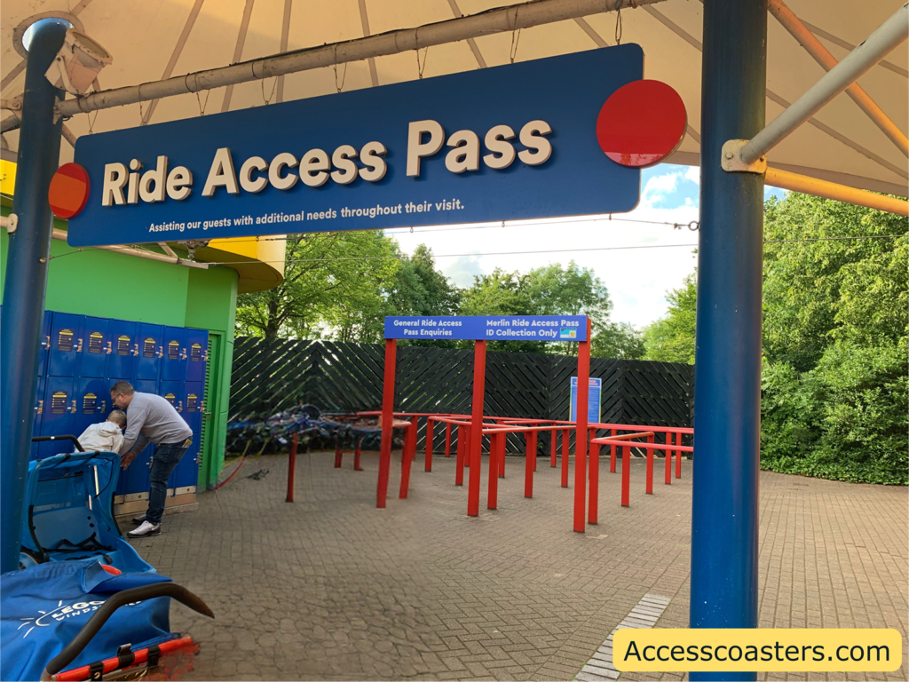 Image of Legoland ride access pass hub. In the image you can see a sign saying ride access pass and then two queue lines one that left queue labelled general ride access pass enquiries and the right queue is labelled Merlin ride access pass ID collection only.