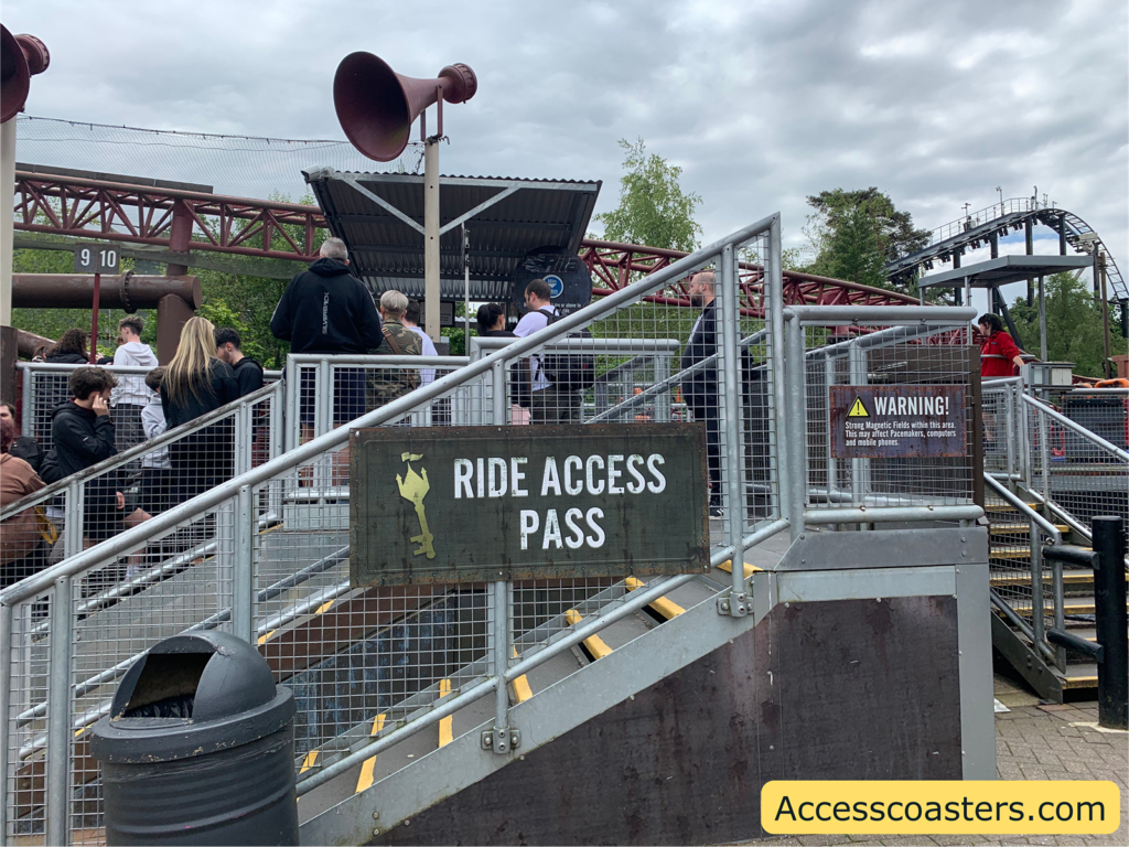 Image shows Rita ride access pass entrance. In the image you can see a big sign that says ride access pass and a set of stairs.