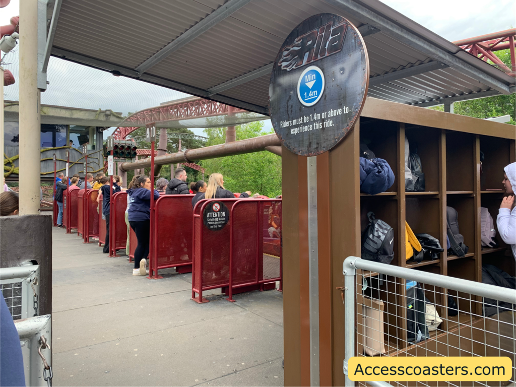 Image of Rita ride station in the image you can see the air gates and people waiting for the ride as well as the baggage storage. 