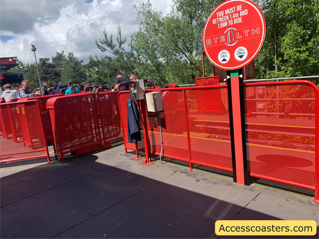 Image of Stealth ride station in the image you can see the air gates and people waiting for the ride.