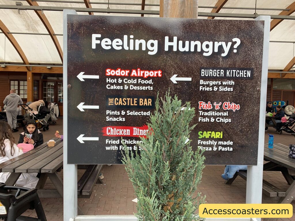 Sign says feeling hungry with each food outlet listed and arrows pointing in the direction of where the food outlet is located. 