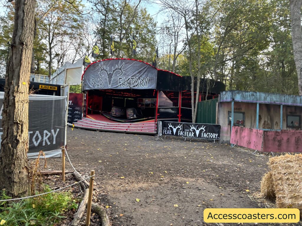 faraway image of the exteria of a waltxer ride themed ti dincaster fear factory. 