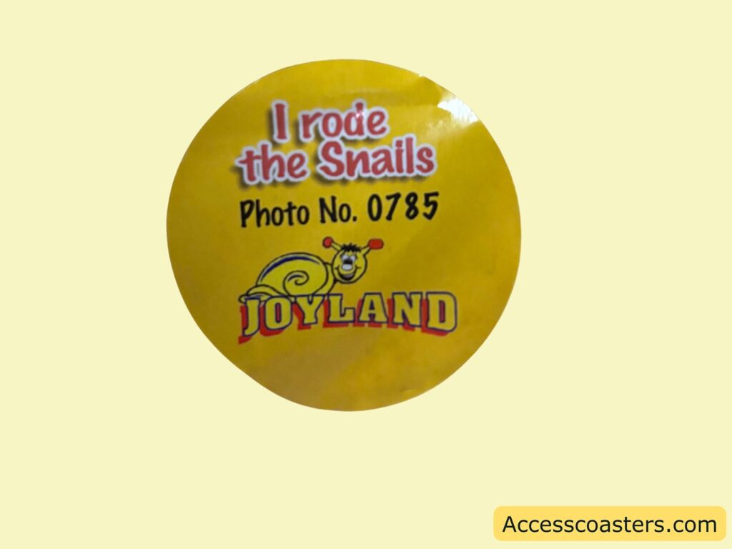 image of a sticker that reads i rode the snails with a photo number and the joyland logo