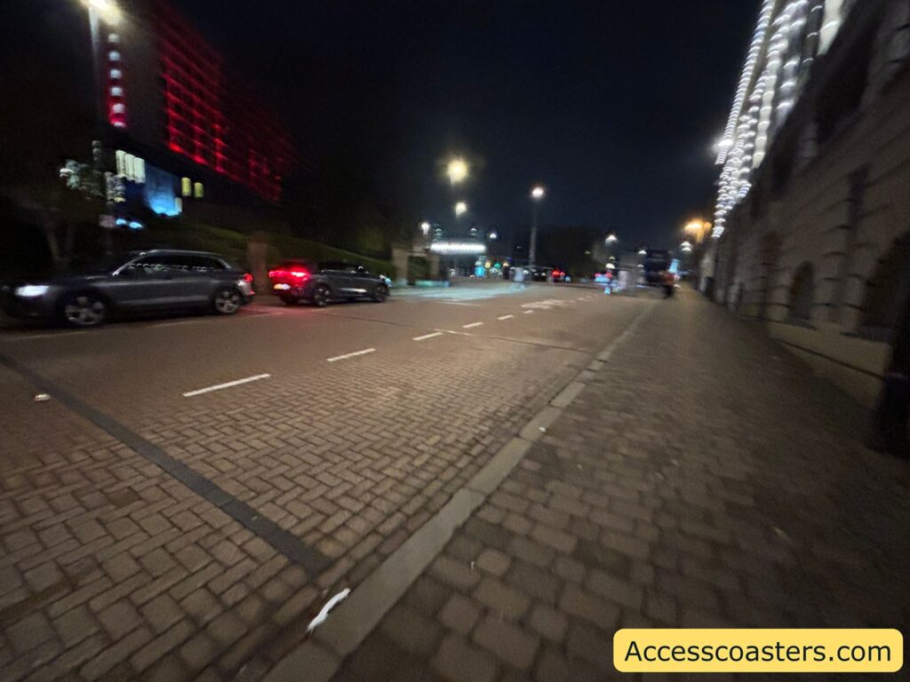 image of on street disabled parking with white shevonse on the floor of the road and the word disabled with a disabled parking sign.