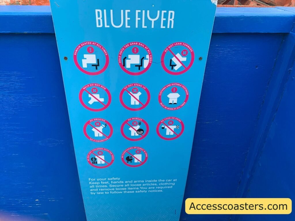image of ride restriction board for blue flyer restrictions include do not stand up, no phones. 