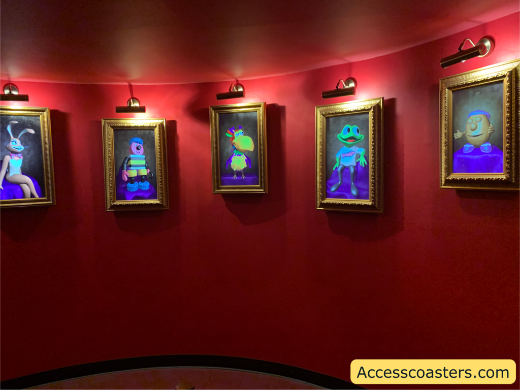 Image of the exit corridor for the cinema with pictures in frames of the Cadbury characters on the wall.