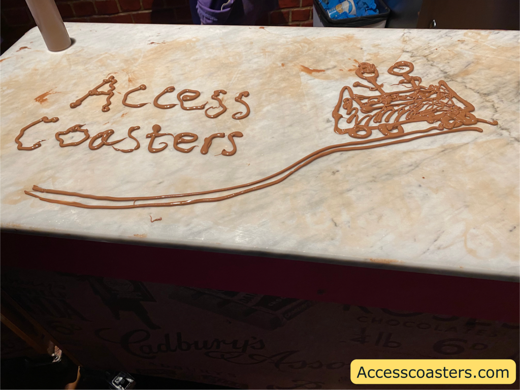 Image of access coasters and rollercoaster all drawn in melted chocolate 