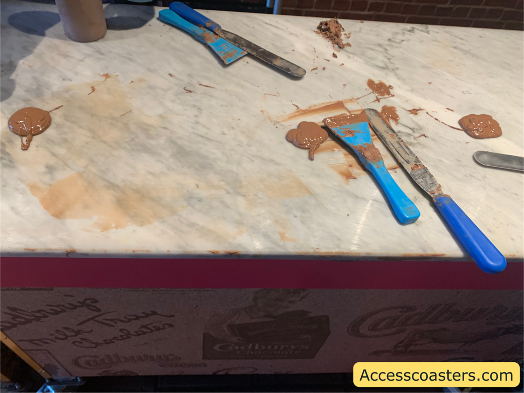 Image of melted chocolate and tools to temper the Chocolate. 