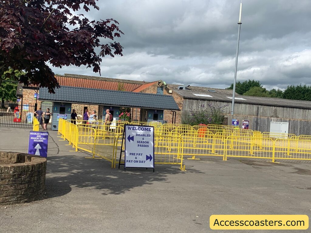 image shows entrance to lightwater valley in the image you can see the admitions desks and yellow barriers making a queue line 