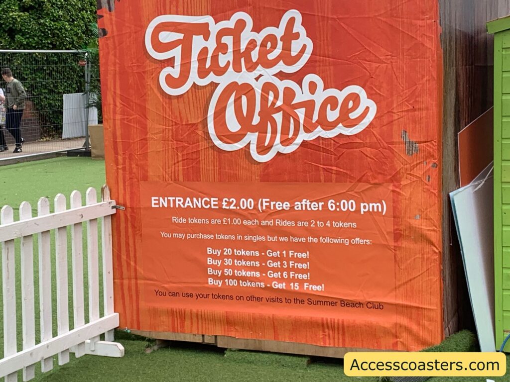 image of a sign with pricing that reads entry £2 (fee after 6pm) ride tokens are £1 each and rides are 2 to 4 tokens. You may purchase tokens in singles but we have the following offers: buy 20 tokens get one free buy 30 tokens get 3 free buy 50 tokens get 6 free buy 100 tokens get 15 free you can use your tokens on other visits to summer beach club.