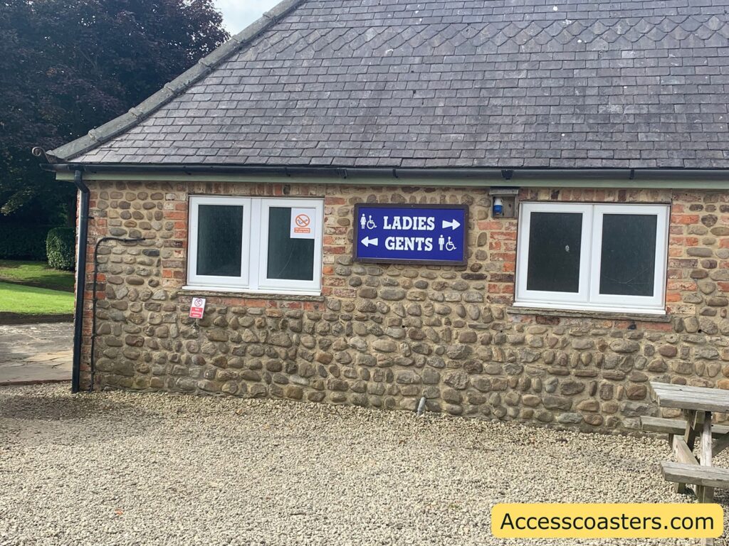 image of building with sign saying male toilets, ladies toilet baby change and disabled toilet 