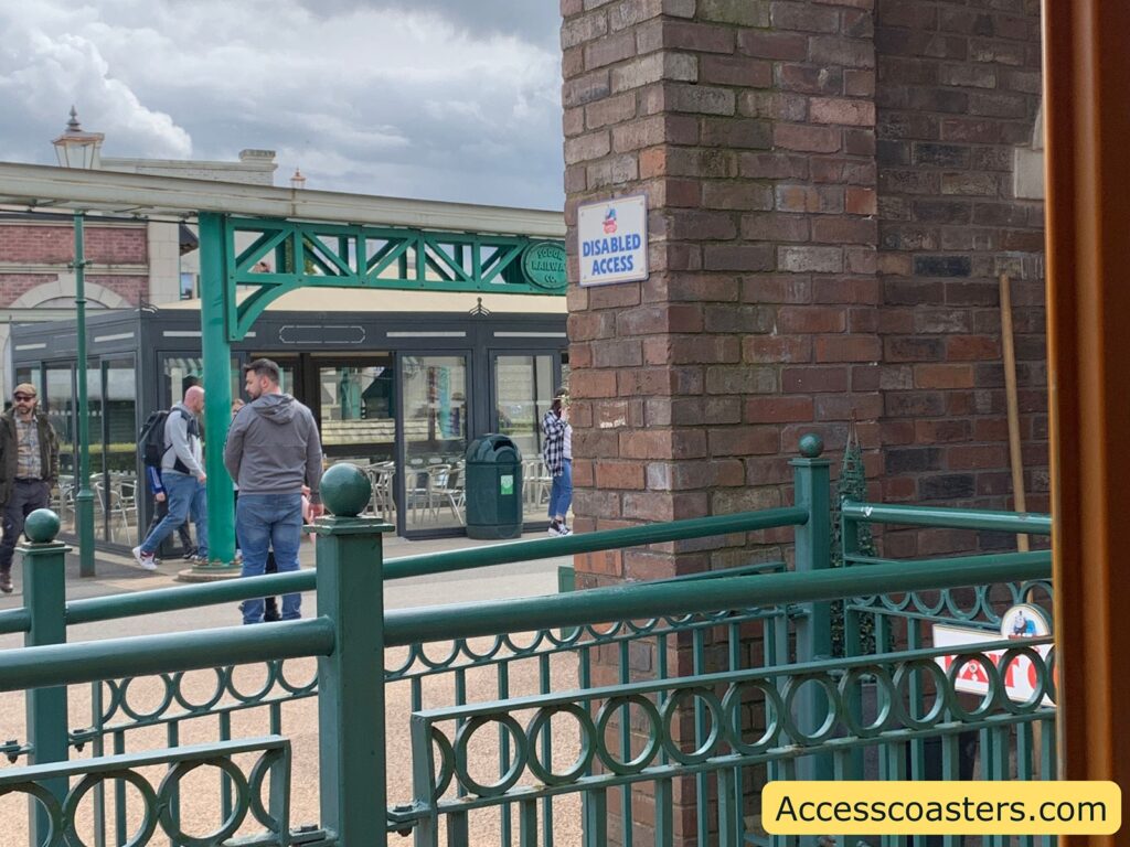 image shows ramp leading up to train station with a sign that reads disabled access 