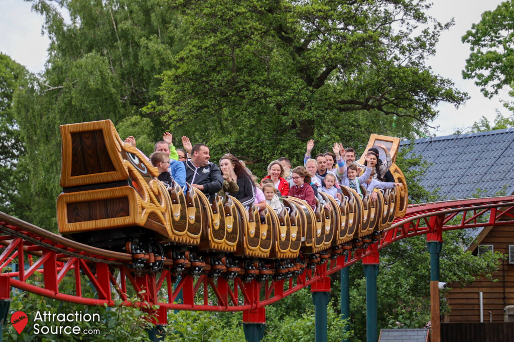 Image shows Jormungandr rollercoaster going around the track. 