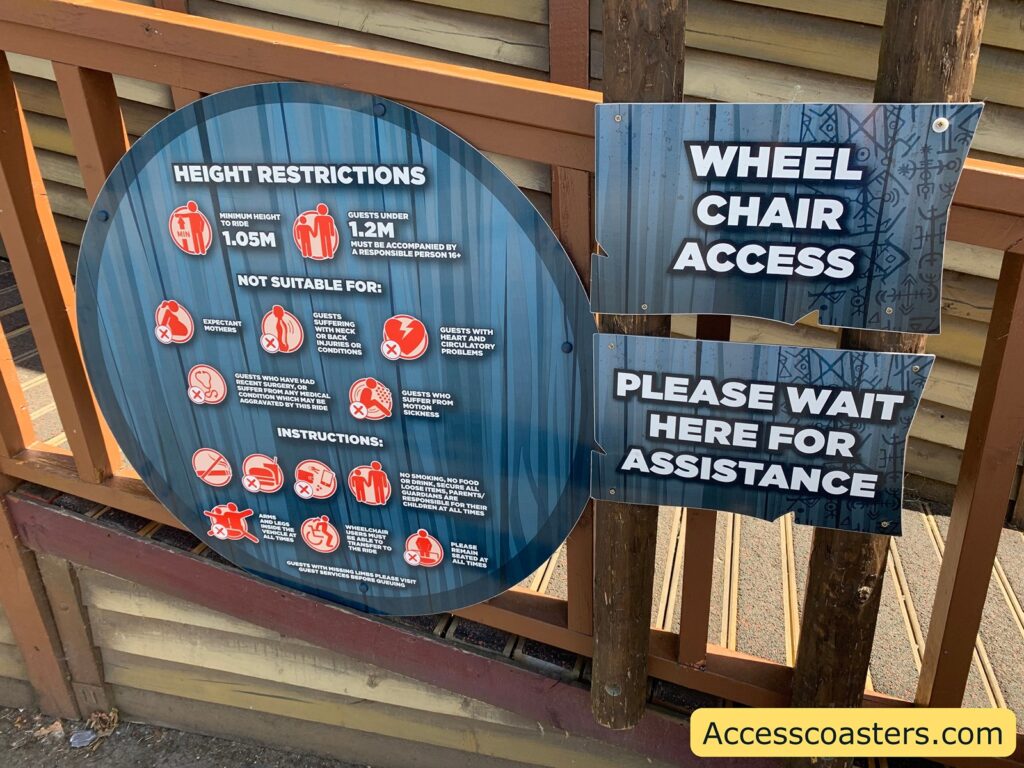 image of Jormungandr ride restriction board and wheelchair access sign 