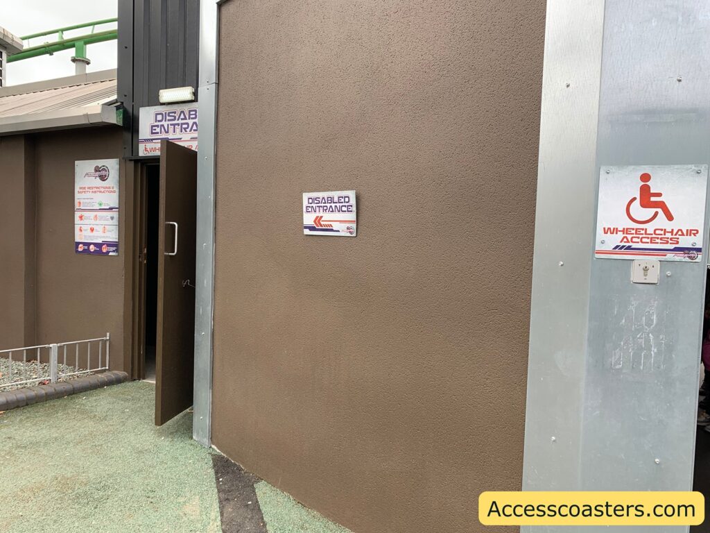 in the image you can see a door leading through to a queueline with a sign that reads disabled entrance. Underneath it says wheelchair access with an arow pointing to the exit.  