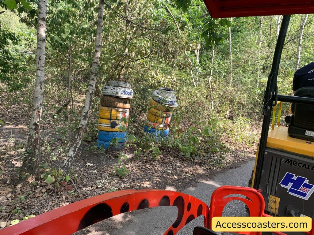 two stacks of car tires painted to look like people/characters.
