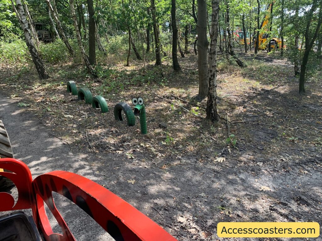 a snack model made out of tires cut in half to the side of the train