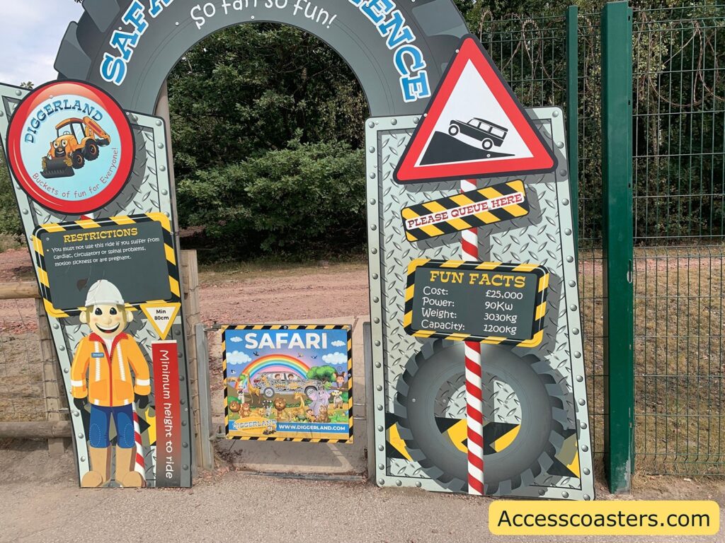 Entrance gate to a safari ride. The archway is labeled "SAFARI EXPERIENCE" with colorful, playful signage. the artchway sign reads Left Side:
DIGGERLAND
Buckets of fun for Everyone!
RESTRICTIONS
You must not use this ride if you SUFFER from cardiac, circulatory or spinal problems, motion sickness or are pregnant.
Min 80cm
Minimum height to ride
Middle:
SAFARI
Right Side:
PLEASE QUEUE HERE
FUN FACTS
Cost: £25,000
Power: 90Kw
Weight: 3030kg
Capacity: 1200kg