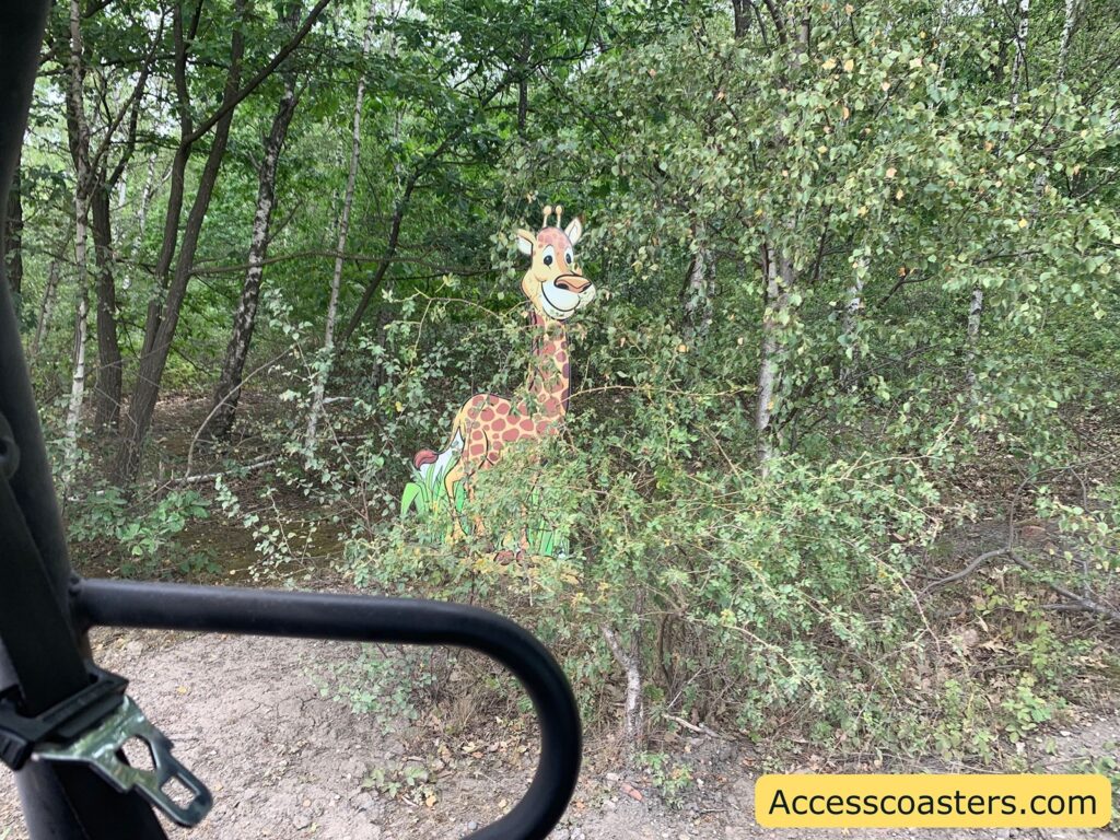 cut out image of a giraffe Infront of the safari vhical