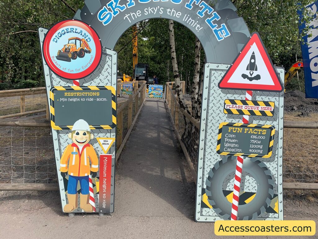 Entrance signage for a theme park ride called "Sky Shuttle" **DIGGERLAND** Buckets of fun for Everyone! **RESTRICTIONS** Min height to ride - 80cm. Min 80cm Minimum height to ride