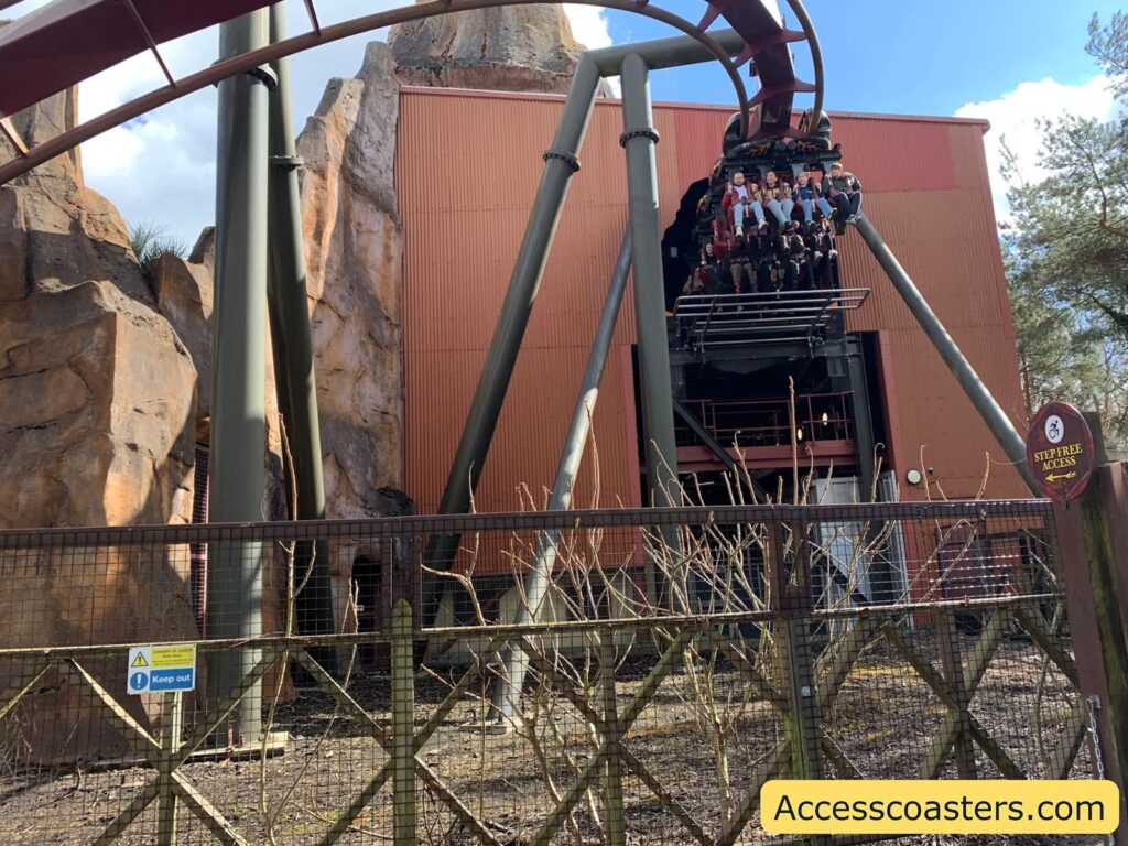 Nemesis Inferno roller coaster train leaving the station