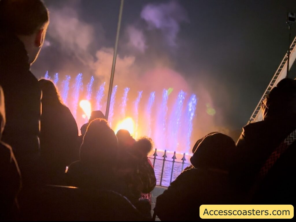 image of purple water fountine and fire