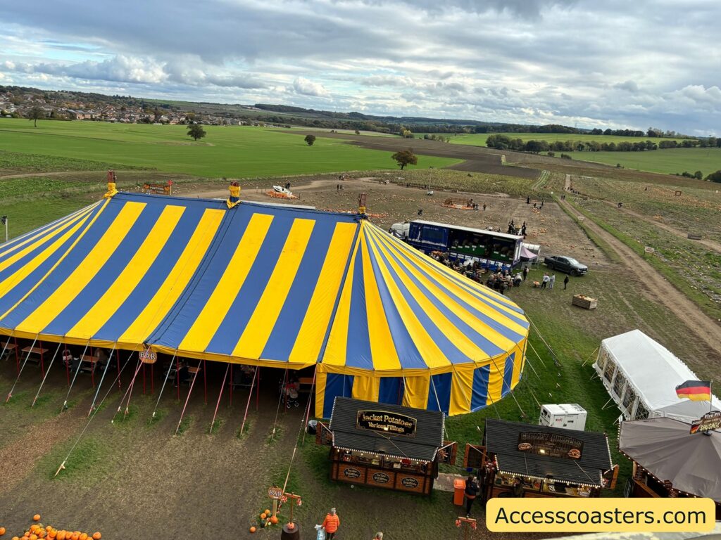  An aerial view of the large blue and yellow striped marquee tent