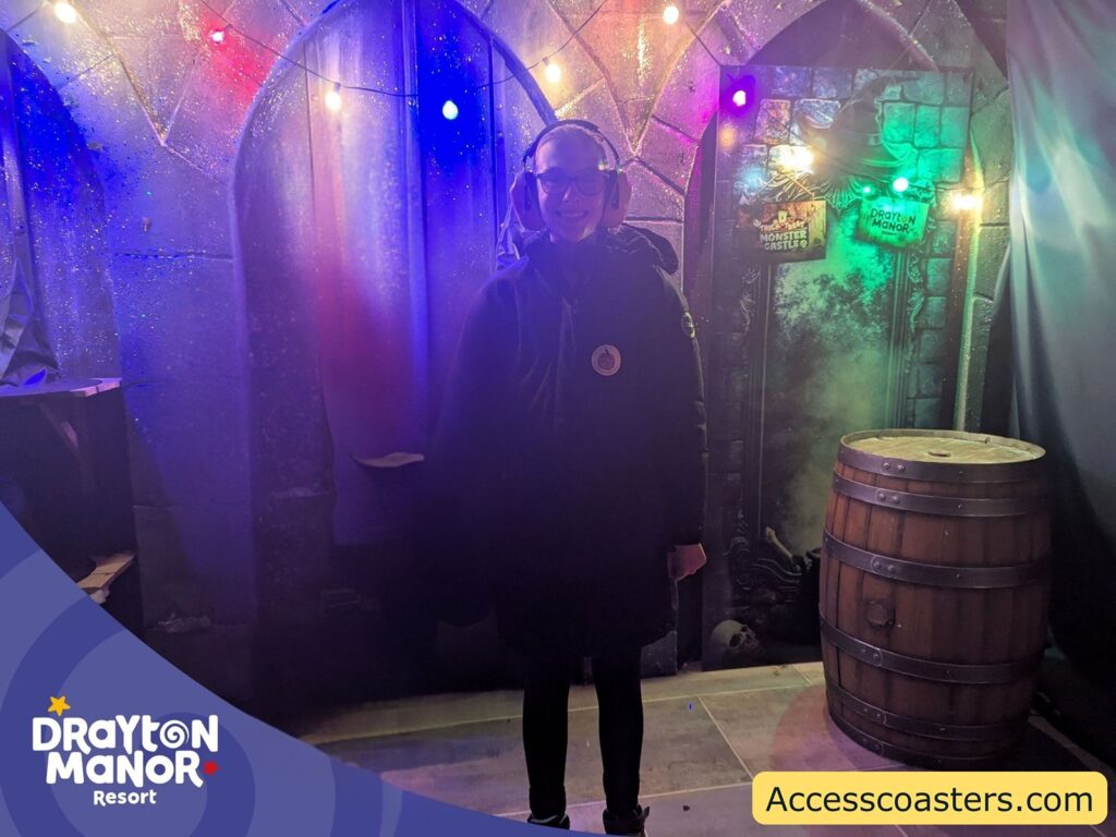 Iona stood in witch photo opportunity with drayton logo in corner 