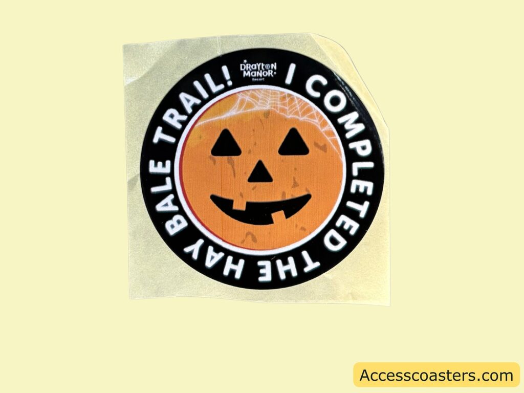 A circular orange and black sticker with a smiling Pumpkin face reads "I COMPLETED THE HAY BALE TRAIL!"