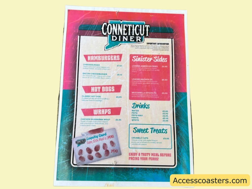 A photo of the Connecticut Diner menu on a pink and teal background. The menu features the following items:
Hamburgers:
- Beef Cheeseburger £7.50
- BBQ Cheeseburger £7.50

Hot Dogs:
- Classic Hotdog £6.50
- BBQ Hotdog £6.50

Wraps:
- Chicken Shawarma Wrap £7.50

Sinister Sides:
- Large Hashbrowns £3.00
- Loaded Hashbrowns £3.50
- Skin-on Fries £3.00
- Curly Fries £3.50
- Loaded Fries £4.50

Drinks:
- Water £2.00
- Hot Drink £2.00
- Can £2.00

Sweet Treats:
- Churros £4.00
- Churros with Dip £4.50
