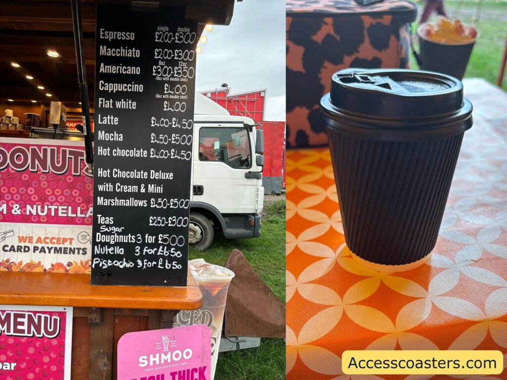 A takeaway cup of hot chocolate on a counter at the pumpkin festival, next to a blackboard menu 