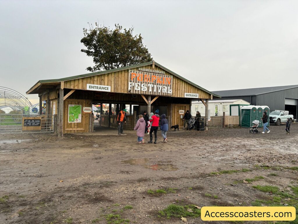 Large wooded hut used as the admissions area for the pumpkin festival.
