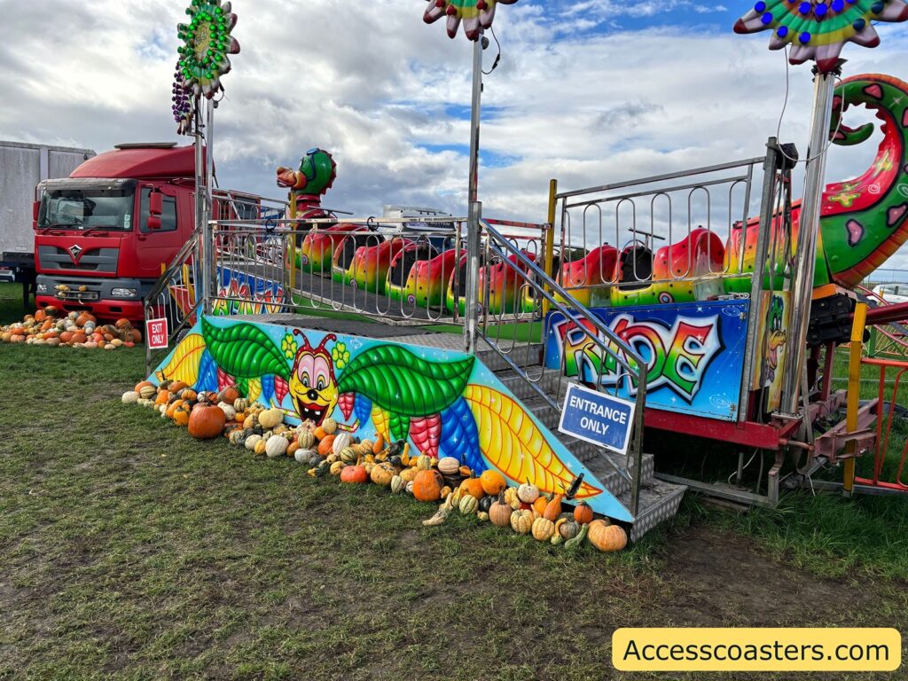 children’s rollercoaster surrounded by pumpkins, 