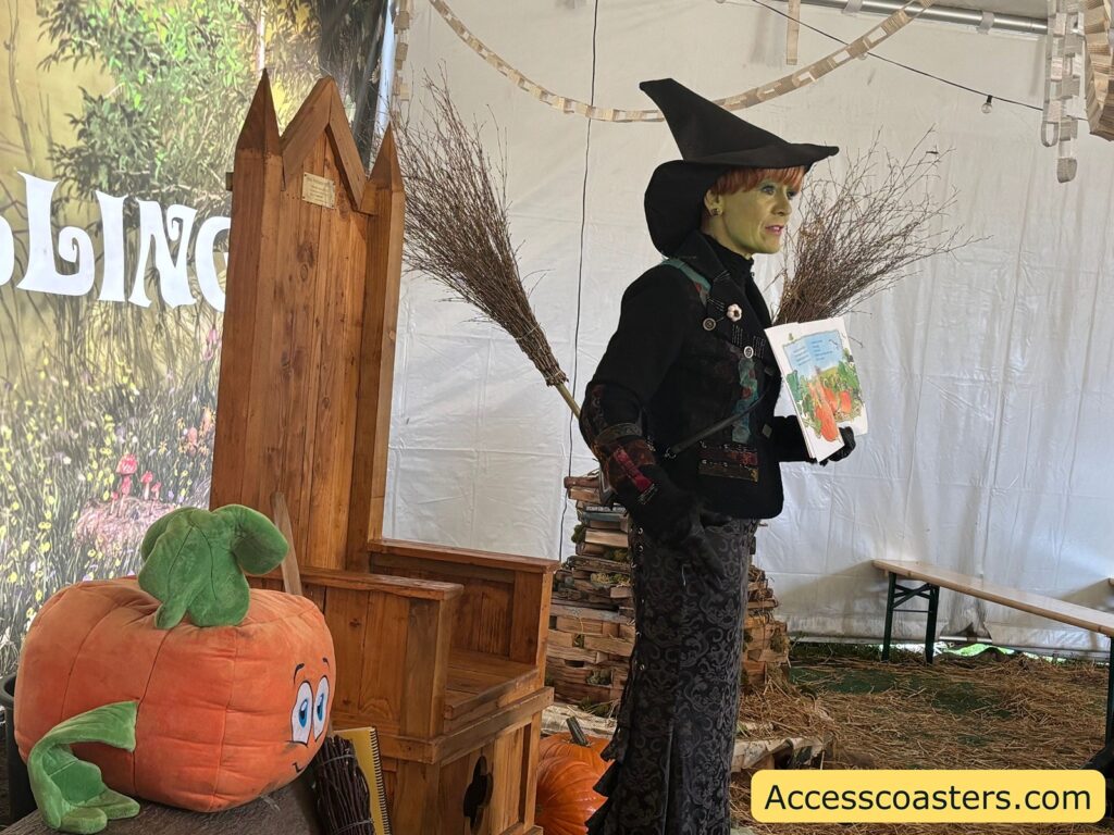 a witch stood reading the story to the audiance. 