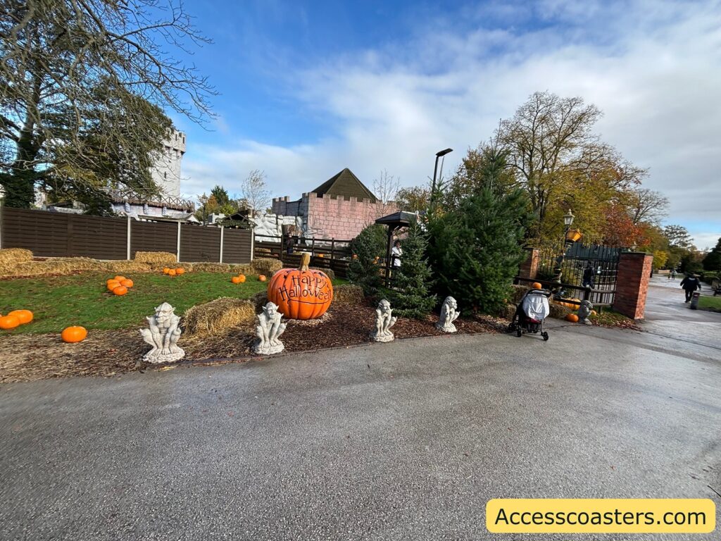 castle’s exterior path, decorated for Halloween, with ghost figures and pumpkins 