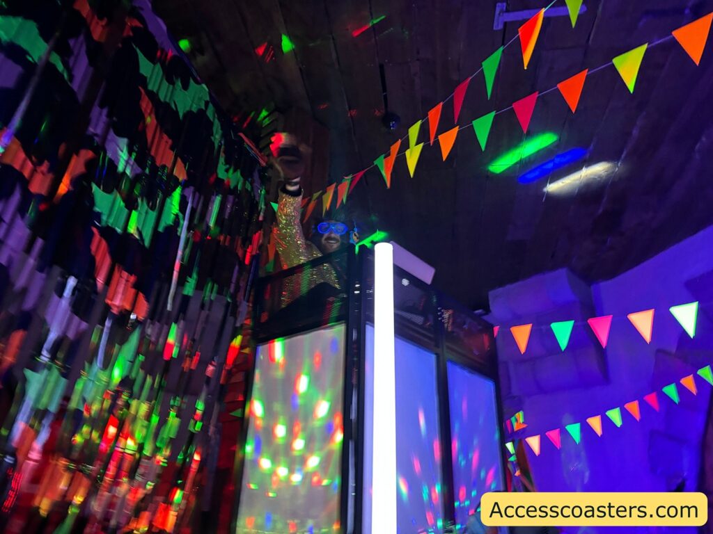 A party room filled with colorful lights and bunting,