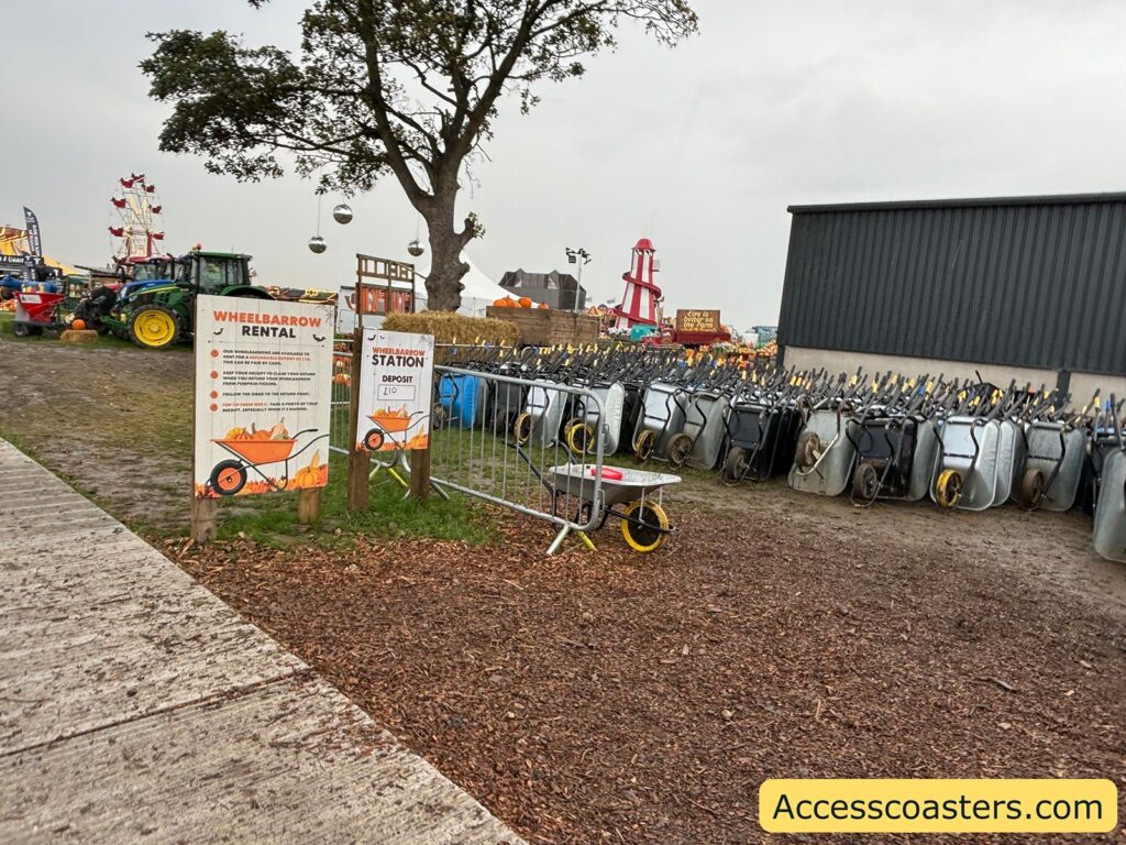 wheelbarow hiring area with lots of wheelbarrows lined up. 