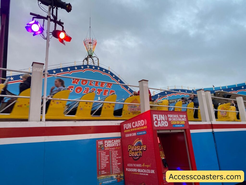 image of yellow rollercoaster cart in motion 