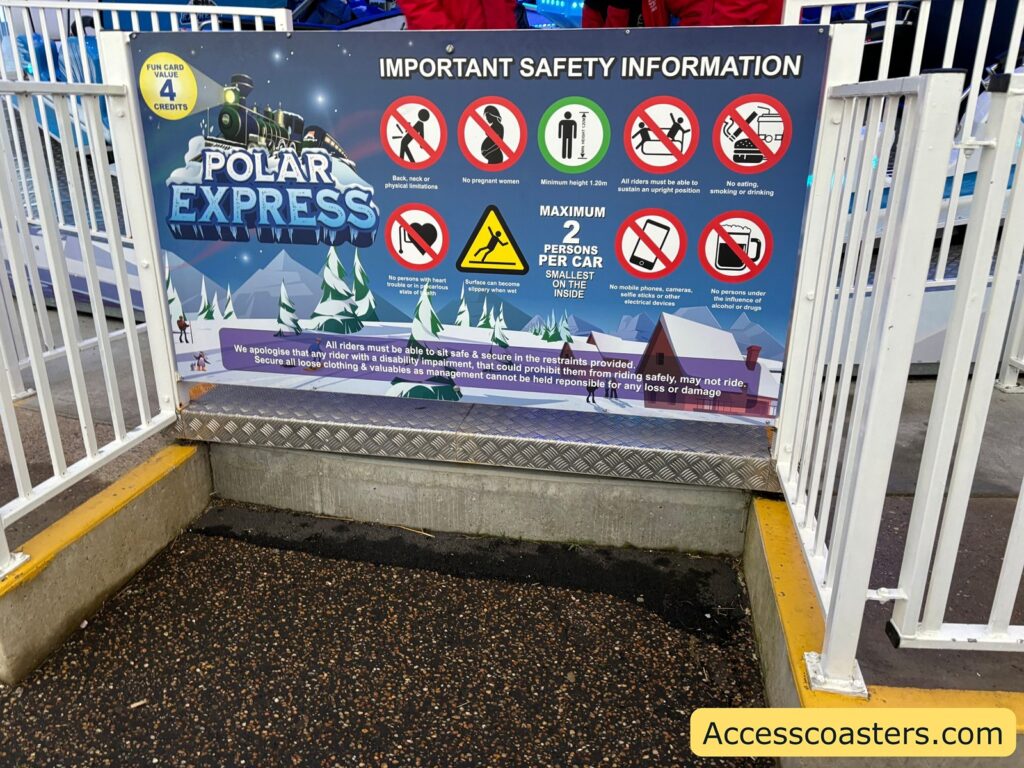 Polar Express ride with a safety information board displaying important rules and guidelines
