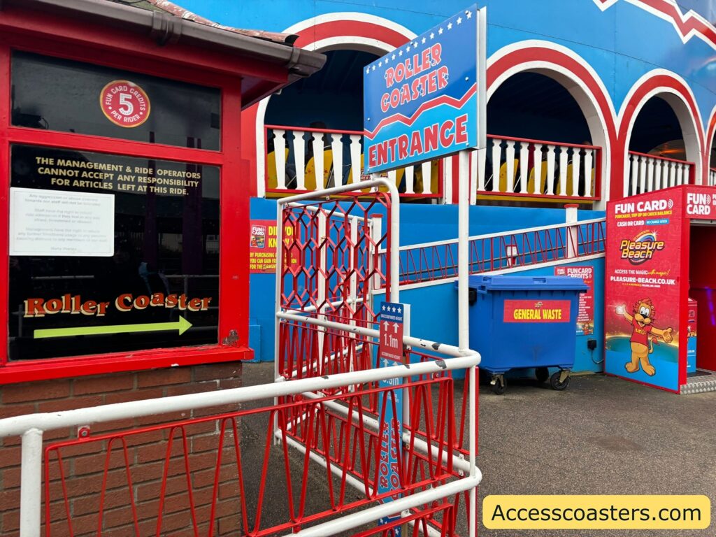 Roller Coaster station entrance with signage and ticket window.