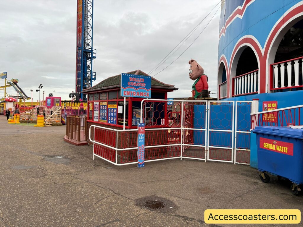 Roller Coaster entrance, with blue and white fencing visible.