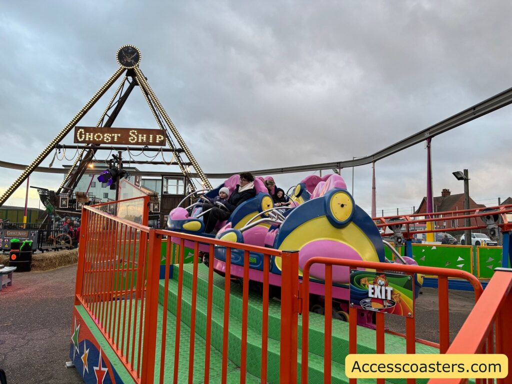 image of ride platorm for coaster with ride carts visable in station 