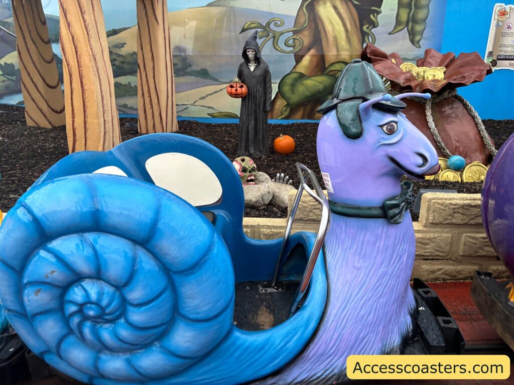 close-up of a blue snail-themed ride car 