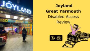 image of Iona stood outside the entrance sign for joyand. Yellow background with text to the right side reads Joyland great yarmouth disabled access review with the symbol for trip report and cartoon of Iona riding a rollercoaster
