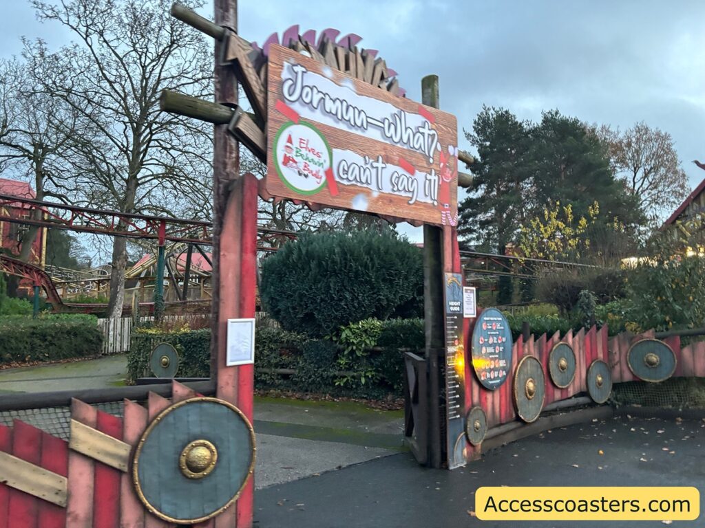 image of the entrance to Jormungander with a big sign that reads Jorman what can't say it. There is an image of an elf on the sign