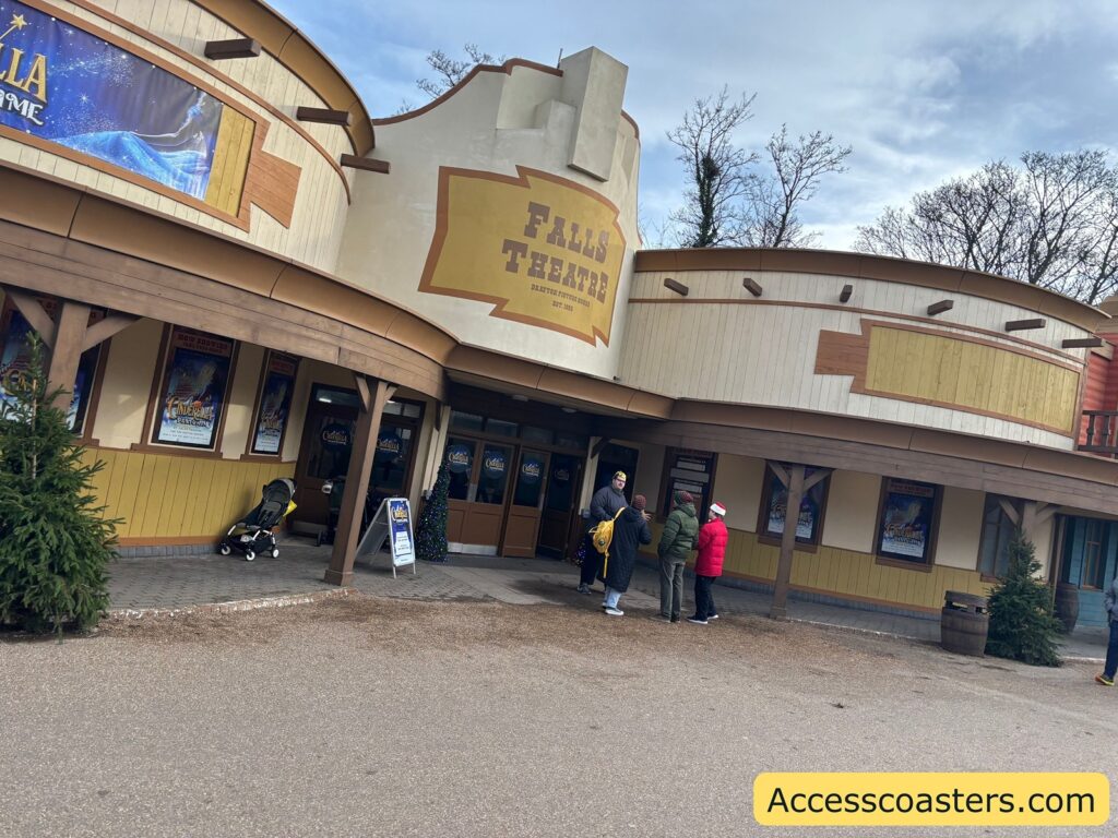 Wide shot of the Falls Theatre entrance showing signage for the pantomime 