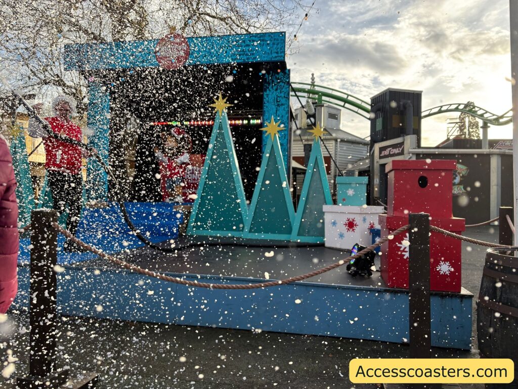 Confetti from a snow machine falls on the Christmas-themed stage at Rory show