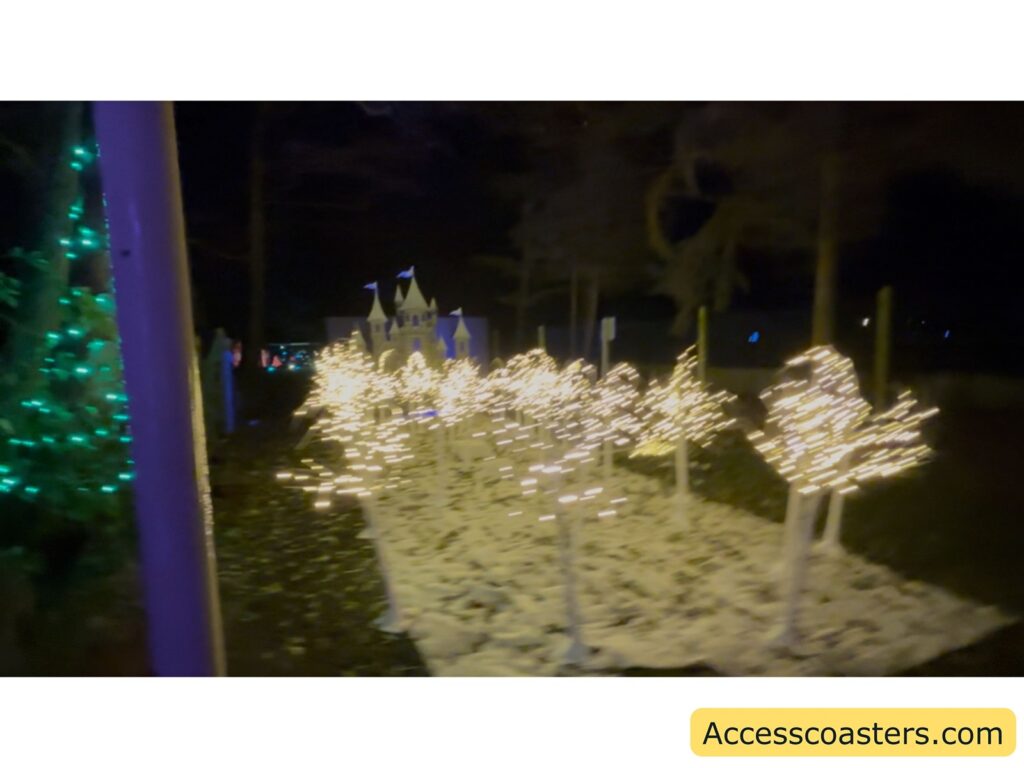 White, lit-up animal figures in a winter-themed light display at night.