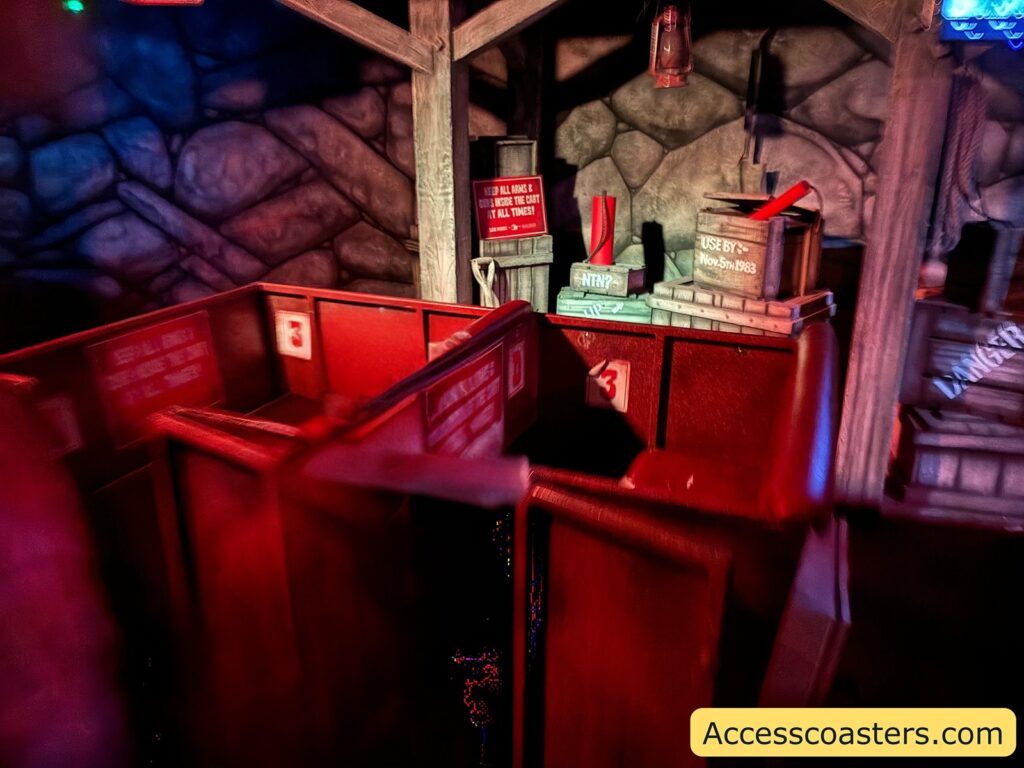 The Root N Tootin Target Trail ride cart seating area, showing the wooden seat and ride controls inside the cart.